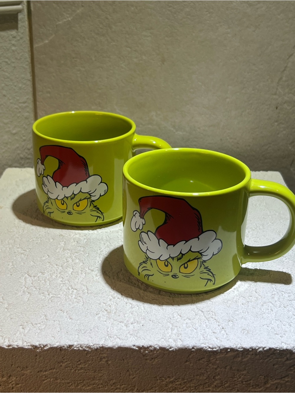 Two Ceramic green GRINCH coffee tea mug cups.